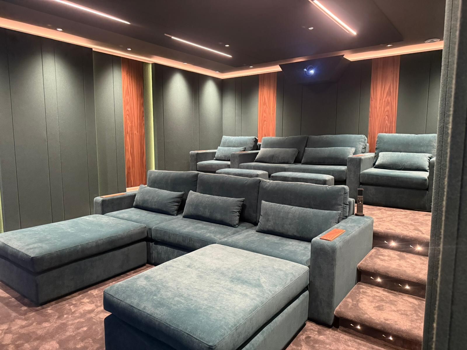 Buckley tiered cinema seating in deep green velvet