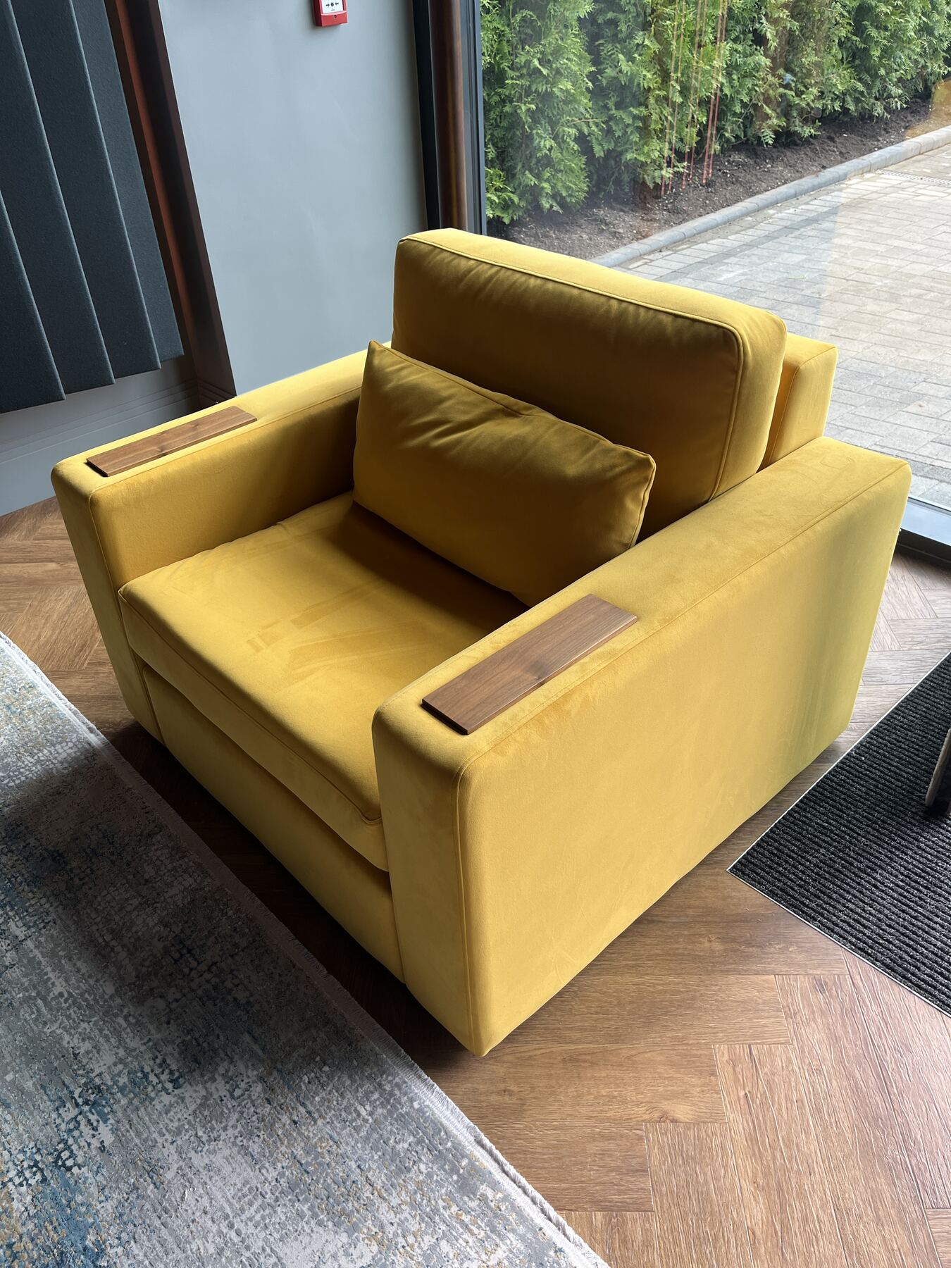 Buckley armchair in mustard velvet with walnut arm caps