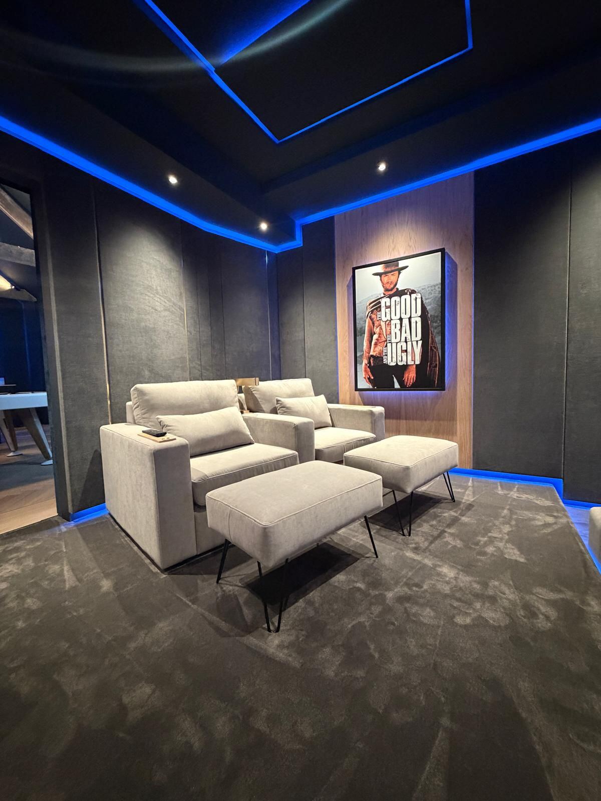 A pair of Buckley armchairs with footstools in a home cinema