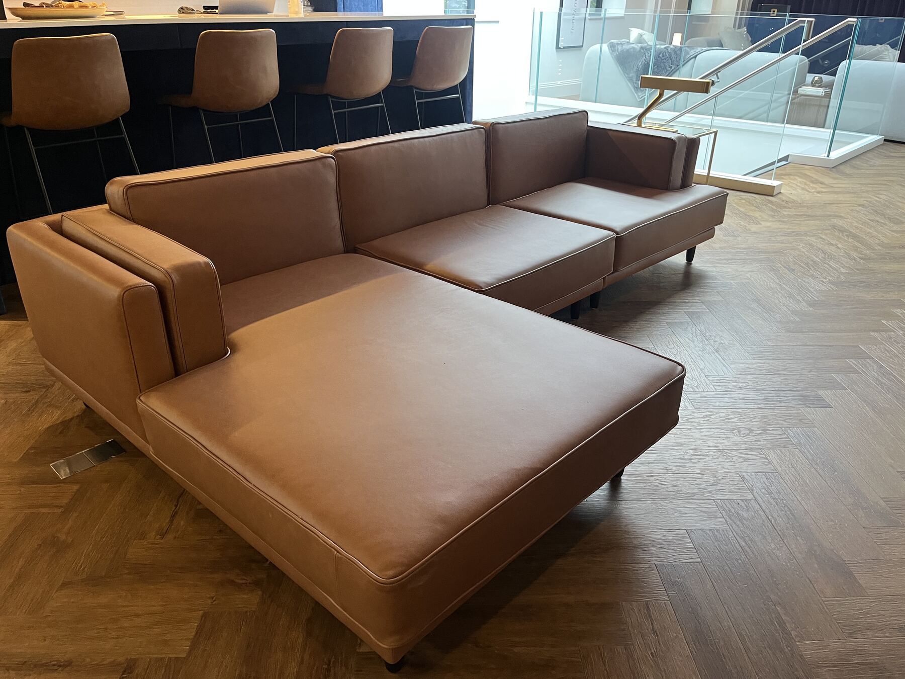 Larsen sofa in tan leather with slender tapered legs